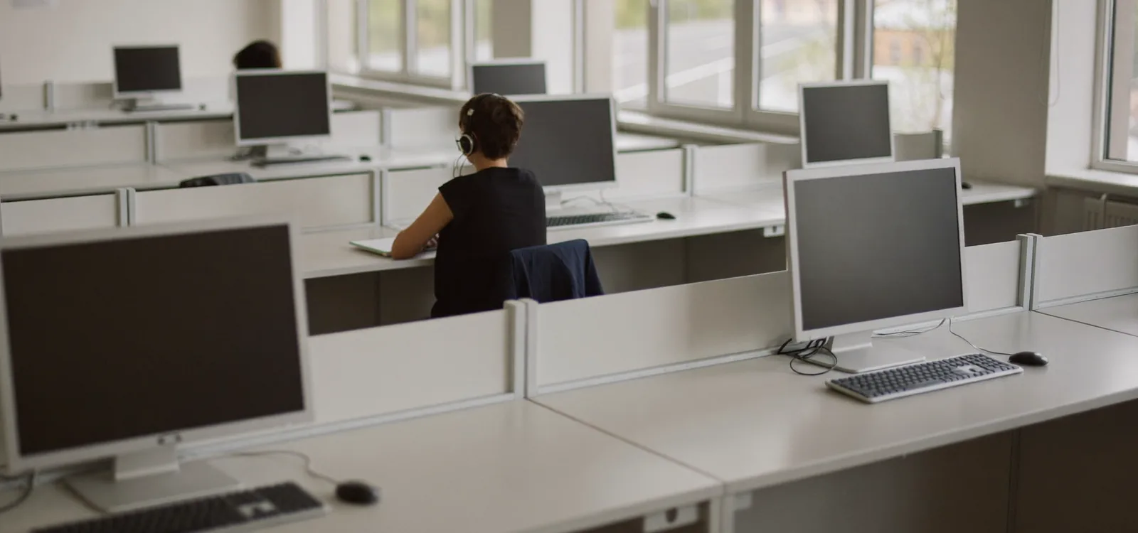 Computer workstations with headsets at a TCF Toronto test centre