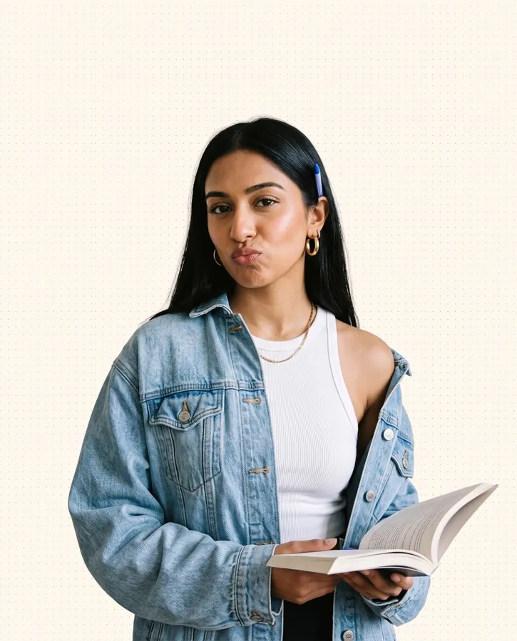 TFA student holding a French textbook
